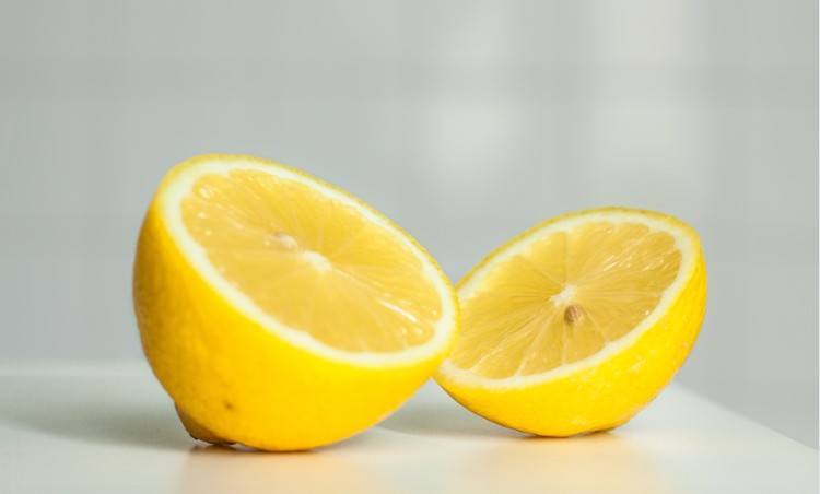 lemon halves on white background