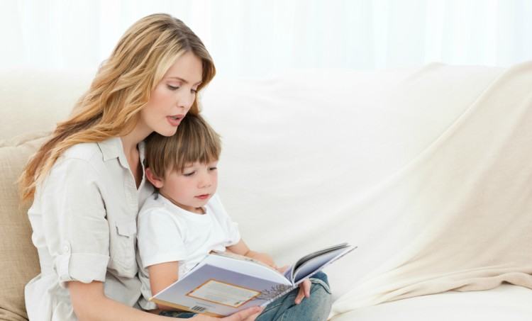 Mom reading with son.